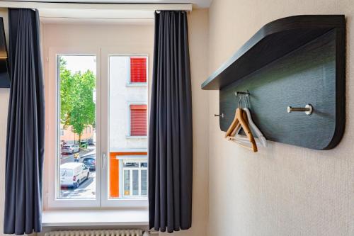 a window with a view of a street at easyHotel Zürich City Main Station in Zürich