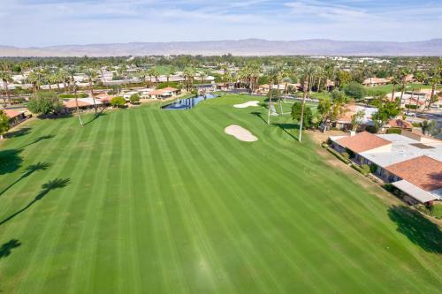 an overhead view of a golf course with a putting green at Designer Seville Condo w Golf Mountain Views in Rancho Mirage