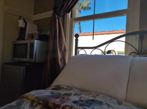 Ένα ή περισσότερα κρεβάτια σε δωμάτιο στο Marina Motel