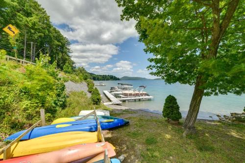 two boats are parked on the shore of a lake at Hatchs Landing Lake Ostego Home in Cooperstown