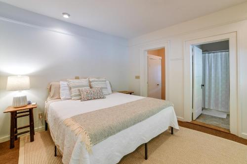 a white bedroom with a bed and a window at Hatchs Landing Lake Ostego Home in Cooperstown