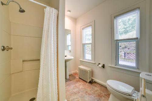 a bathroom with a toilet and a shower at Hatchs Landing Lake Ostego Home in Cooperstown