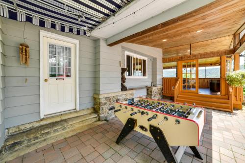 a game room with a foosball table on a house at Hatchs Landing Lake Ostego Home in Cooperstown