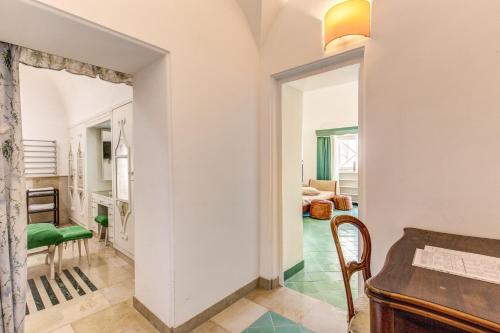 a hallway with a living room and a dining room at Villa Calypso in Capri