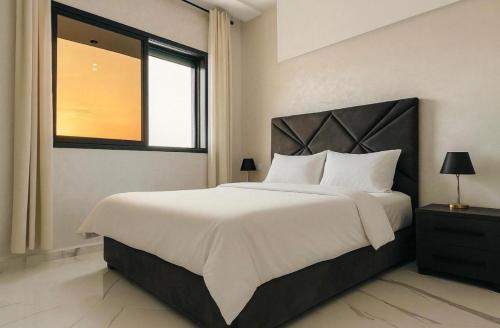 Katil atau katil-katil dalam bilik di Appartement 2 chambres 1 salon
