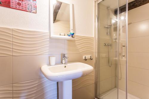 a bathroom with a sink and a shower at Apartment Memories II in Baška
