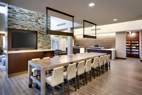 a large dining room with a large table and chairs at Residence Inn Pearland in Pearland