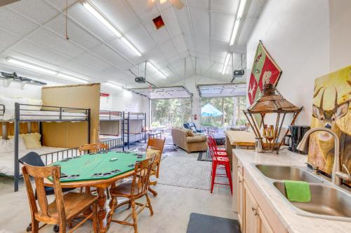 a kitchen with a table and chairs in a room at Walk to Happys Inn Studio with Outdoor Space! in Libby