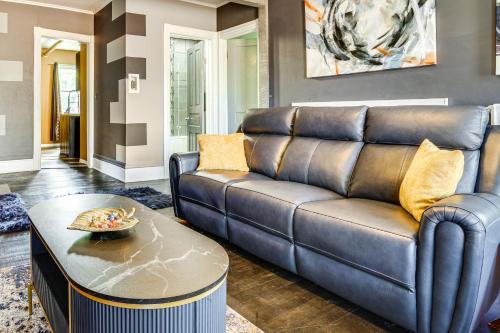 a living room with a couch and a table at Less Than 2 Mi to Dtwn and Mississippi River West Side Home in West Saint Paul