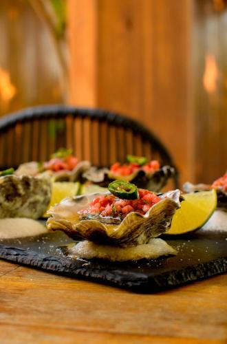 a table with a plate of food on a table at Campera Valle de Guadalupe in Ensenada