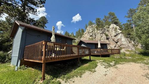 a small chapel with a cross on the side of it at Cozy little pet-friendly cabin in Custer