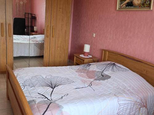 a bedroom with a bed with a drawing on it at Gîte paisible en campagne proche nature - FR-1-583-408 in La Villedieu-en-Fontenette