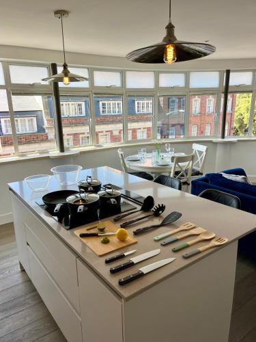 a kitchen with a counter with knives on it at Bournemouth Nest in Bournemouth
