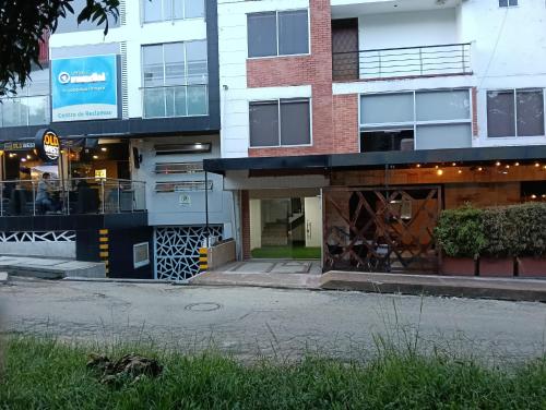 an apartment building with a gate in front of it at Denier House II in Ibagué