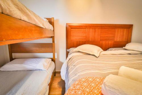 a bedroom with two bunk beds next to each other at HOM I SKI OUT 4PAX Edif Licancabur Valle Nevado 206A in Lo Barnechea