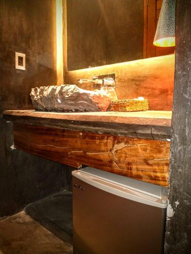 a bathroom with a sink and a counter at Casa Vive Bacalar in Bacalar