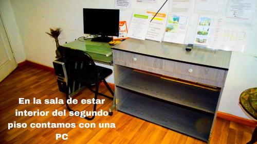 an office with a desk with a computer on it at Hostal Pampaloja Antof in Antofagasta