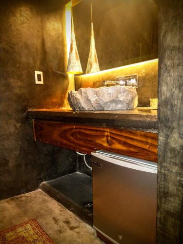 a bathroom with a sink and a mirror at Casa Vive Bacalar in Bacalar