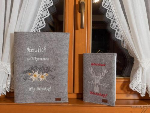 two books are sitting on a window sill at Holiday Apartment in Mittelberg with Wifi in Mittelberg