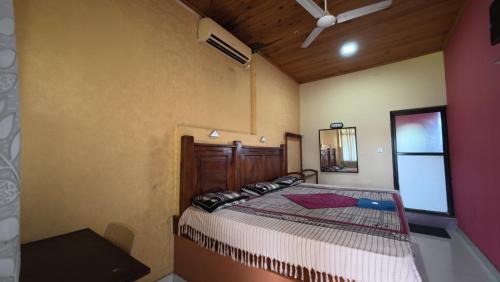 Ένα ή περισσότερα κρεβάτια σε δωμάτιο στο Hotel Janara