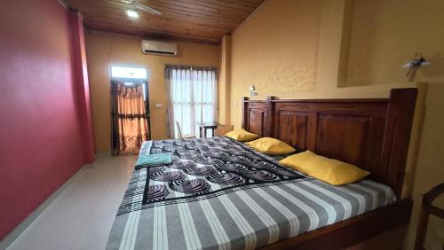 Ένα ή περισσότερα κρεβάτια σε δωμάτιο στο Hotel Janara