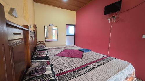 Ένα ή περισσότερα κρεβάτια σε δωμάτιο στο Hotel Janara