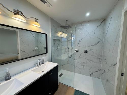 a bathroom with a sink and a shower at Newly Renovated house in the Best location of TriCities in Johnson City