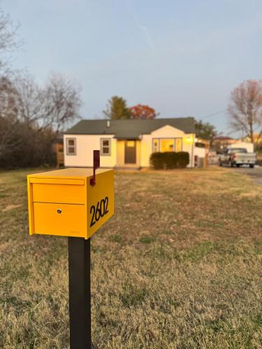 a yellow mailbox in front of a house at Newly Renovated house in the Best location of TriCities in Johnson City