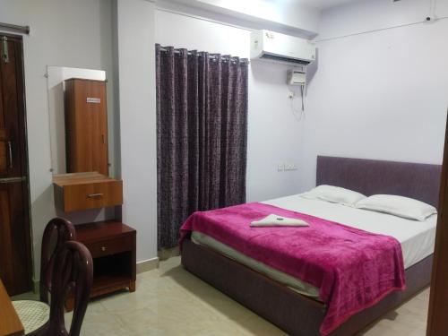 Katil atau katil-katil dalam bilik di Andaman ABC Homestay