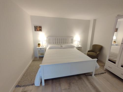 Ένα ή περισσότερα κρεβάτια σε δωμάτιο στο Casa do Eirô