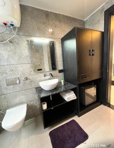 a bathroom with a sink and a toilet at Khas Mahal Homestay in Agra