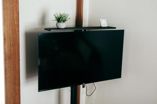 a flat screen tv sitting on top of a wall at Restelle - JR Nara 2min Max 7 guests in Nara