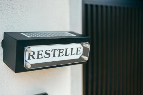 a black and white sign on a wall with the word register at Restelle - JR Nara 2min Max 7 guests in Nara