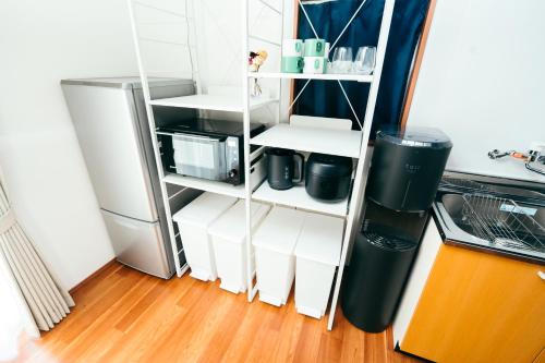 a refrigerator with its door open in a kitchen at Restelle - JR Nara 2min Max 7 guests in Nara