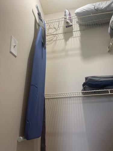 a room with a blue sheet hanging on a wall at Sweet home in Indianapolis
