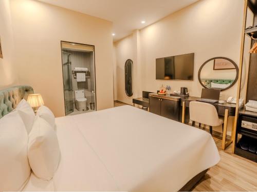 TV a/nebo společenská místnost v ubytování San Hotel & Pool
