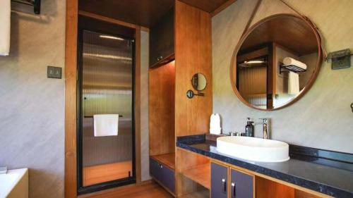 a bathroom with a sink and a mirror at Wildbrook 