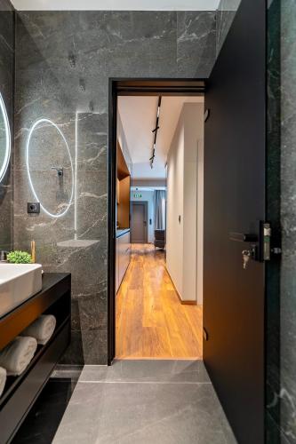 a bathroom with a sink and a mirror at PR Luxury Apartment in Parga