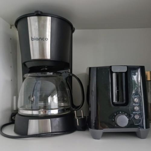 a blender and a toaster on a kitchen counter at Daisy in Nafplio