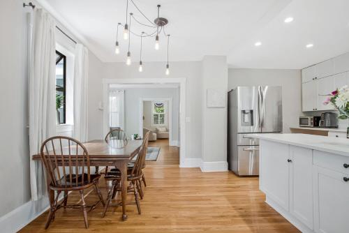 a kitchen with a table and chairs and a dining room at Historic 3 BR Home - 15 Min Walk to N-MC Stadium in Annapolis