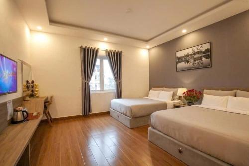 Ένα ή περισσότερα κρεβάτια σε δωμάτιο στο Camellia Villa Đà Lạt