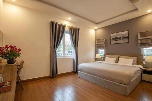 Ένα ή περισσότερα κρεβάτια σε δωμάτιο στο Camellia Villa Đà Lạt
