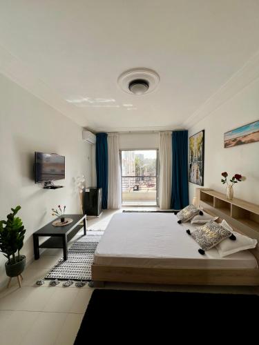Ένα ή περισσότερα κρεβάτια σε δωμάτιο στο Chambre dhôte avec salle de bain privée À deux pas de la plage pour un séjour chaleureux