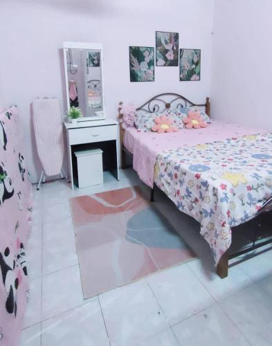 a bedroom with a bed and a mirror at FourtyOne Homestay Mentakab Pahang in Mentekab
