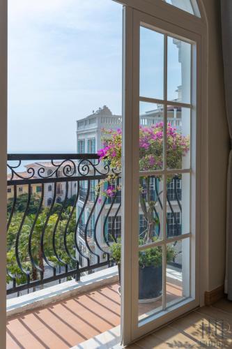 a view from a balcony with a window at HD Hotel Sunset Town in Phu Quoc