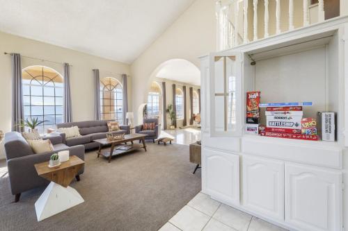 a living room with a couch and a table at Summit House Joshua Tree Iconic Mountain Estate with Spa Ping-Pong Pool Table Fire Pit in Yucca Valley