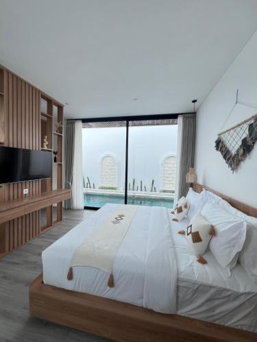 Katil atau katil-katil dalam bilik di Kamaimo Villa
