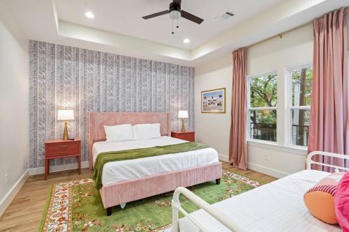 a bedroom with two beds and a window at The Bayou Bungalow- 5 mins to downtown, 10 to NRG, Sleeps 12, Amazing backyard! in Houston