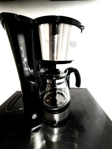 a coffee maker sitting on top of a counter at Quinta Piedad Suites in Guayaquil