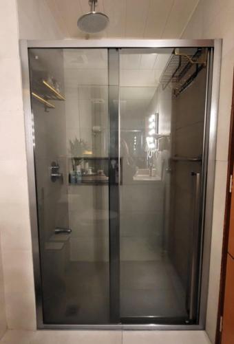 a glass shower in a bathroom with at 1BR Condo near Tourist Spots in Baguio